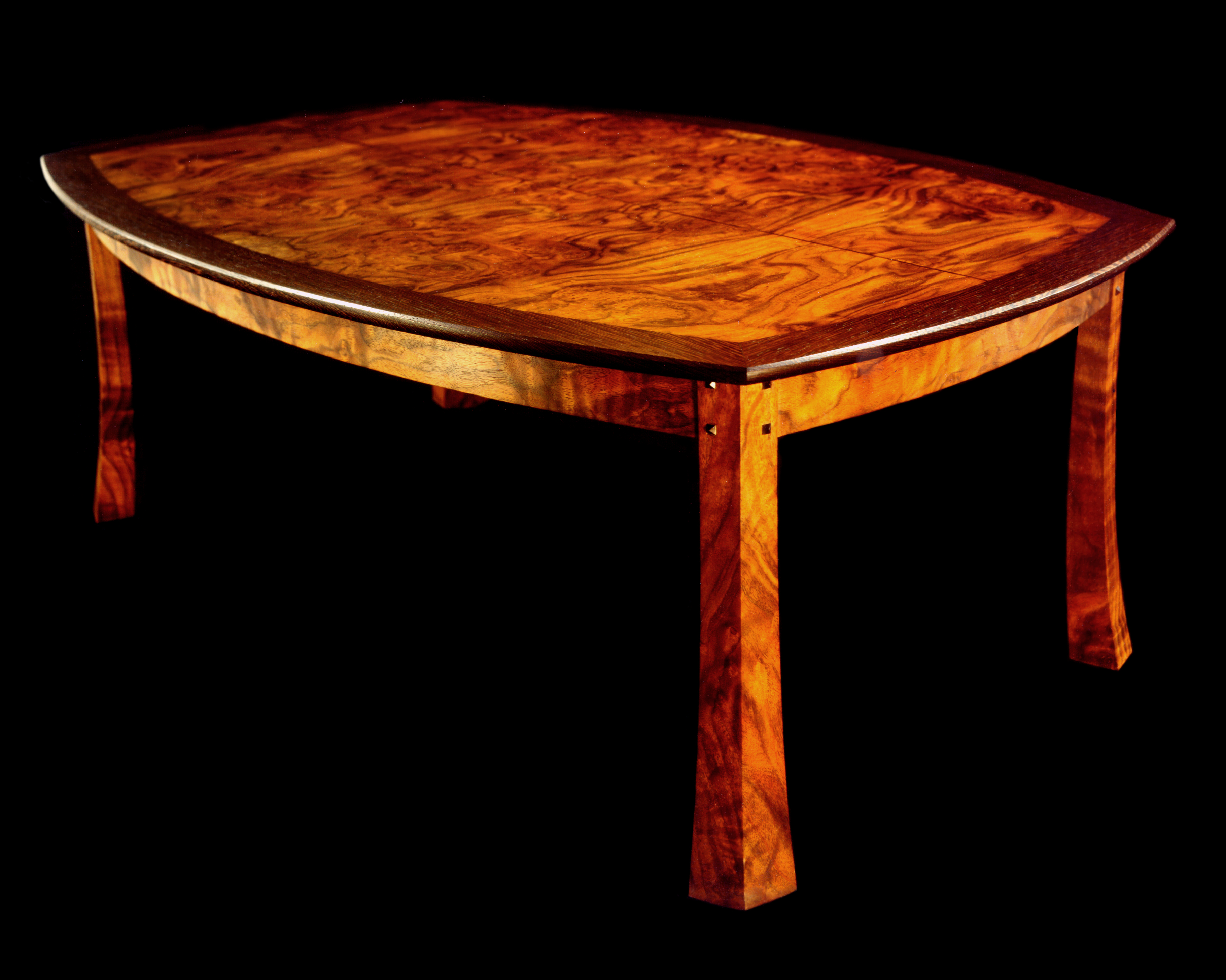 A Walnut Coffie Table With Flaired Legs